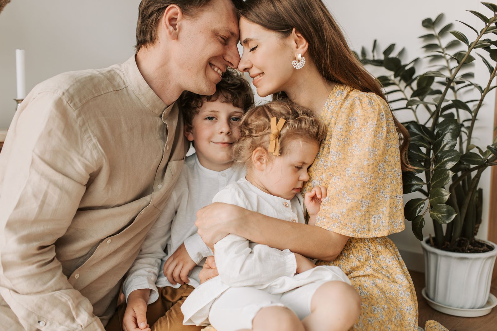 A family relaxing together in the living room of their first home