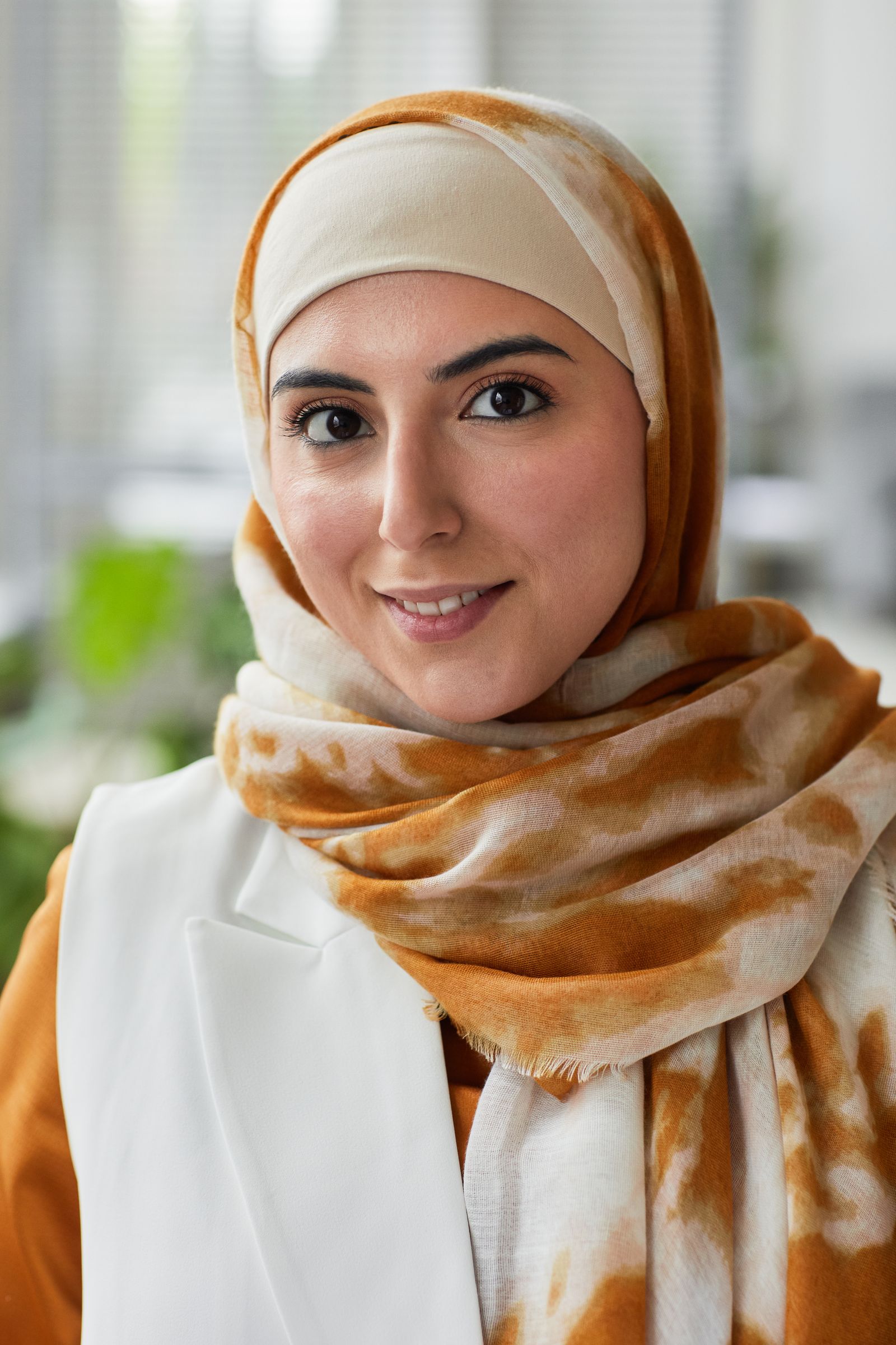 Portrait of Aisha Rahman, Loan Officer