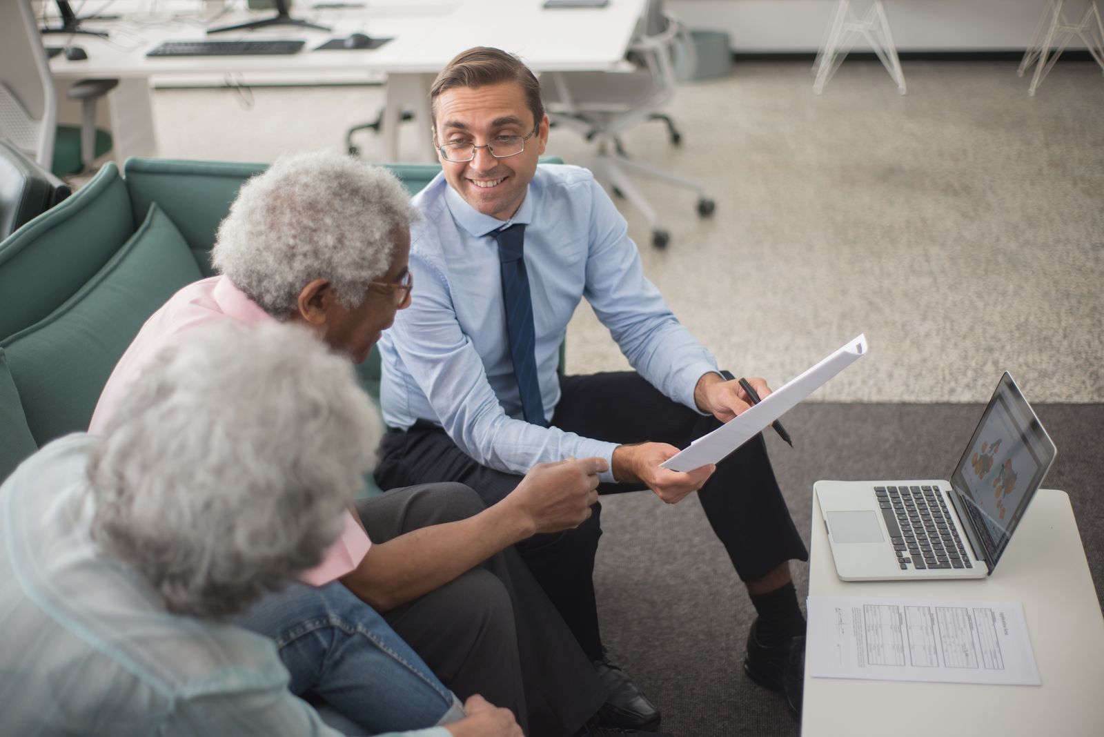 A Harborview loan officer reviewing loan options with clients