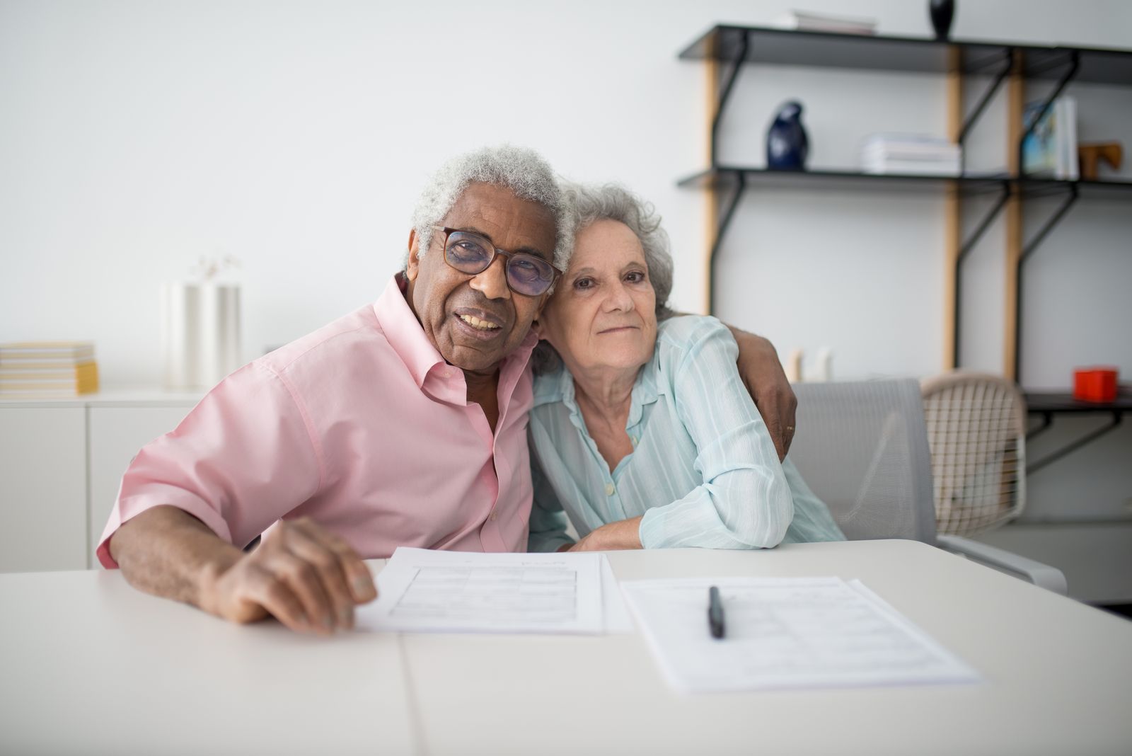 A homeowner reviewing an escrow statement at the kitchen table