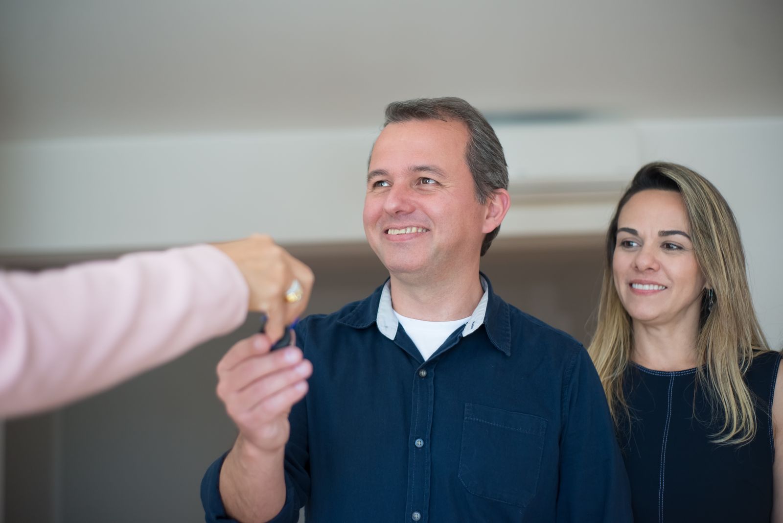 A couple receiving the keys to their new home